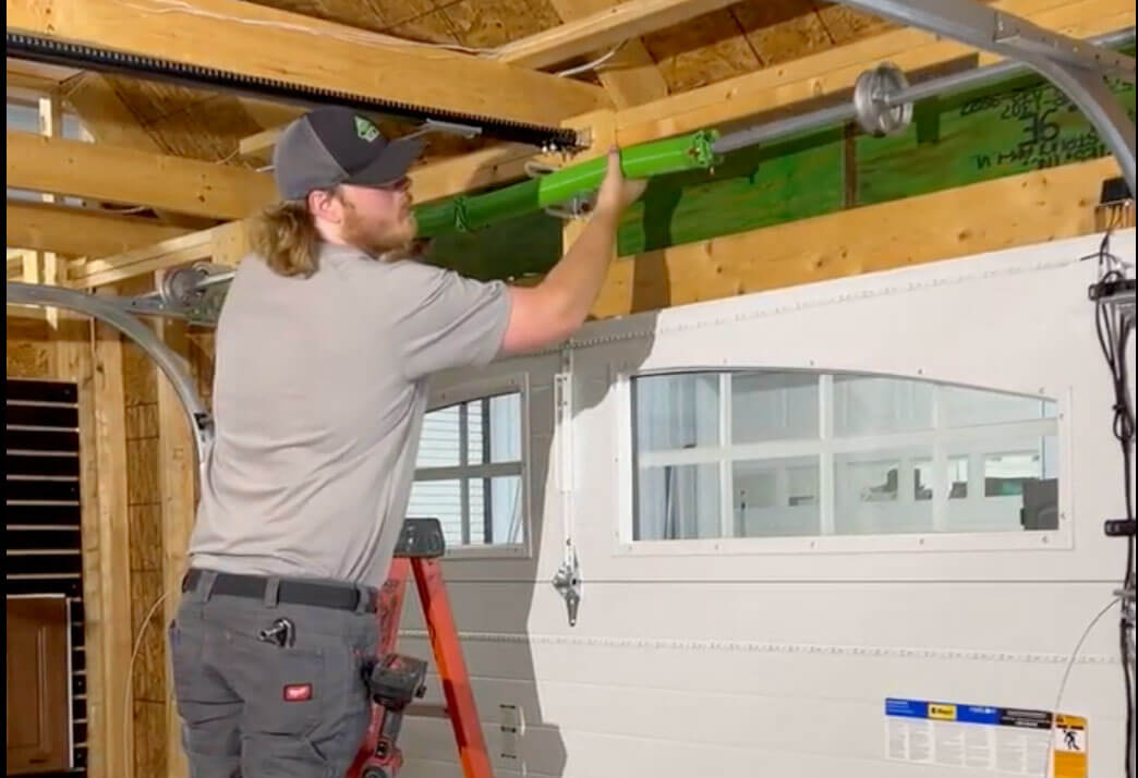 garage door technician doing installation