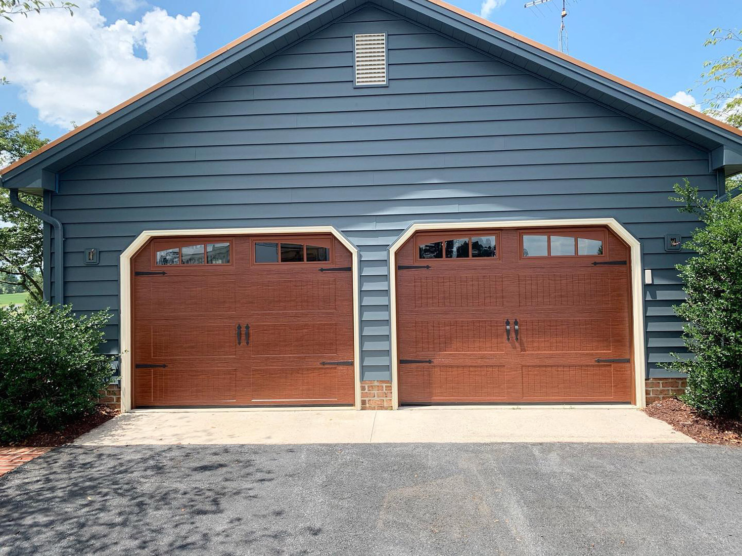 view of a two car garage to show how wide is a two car garage door​