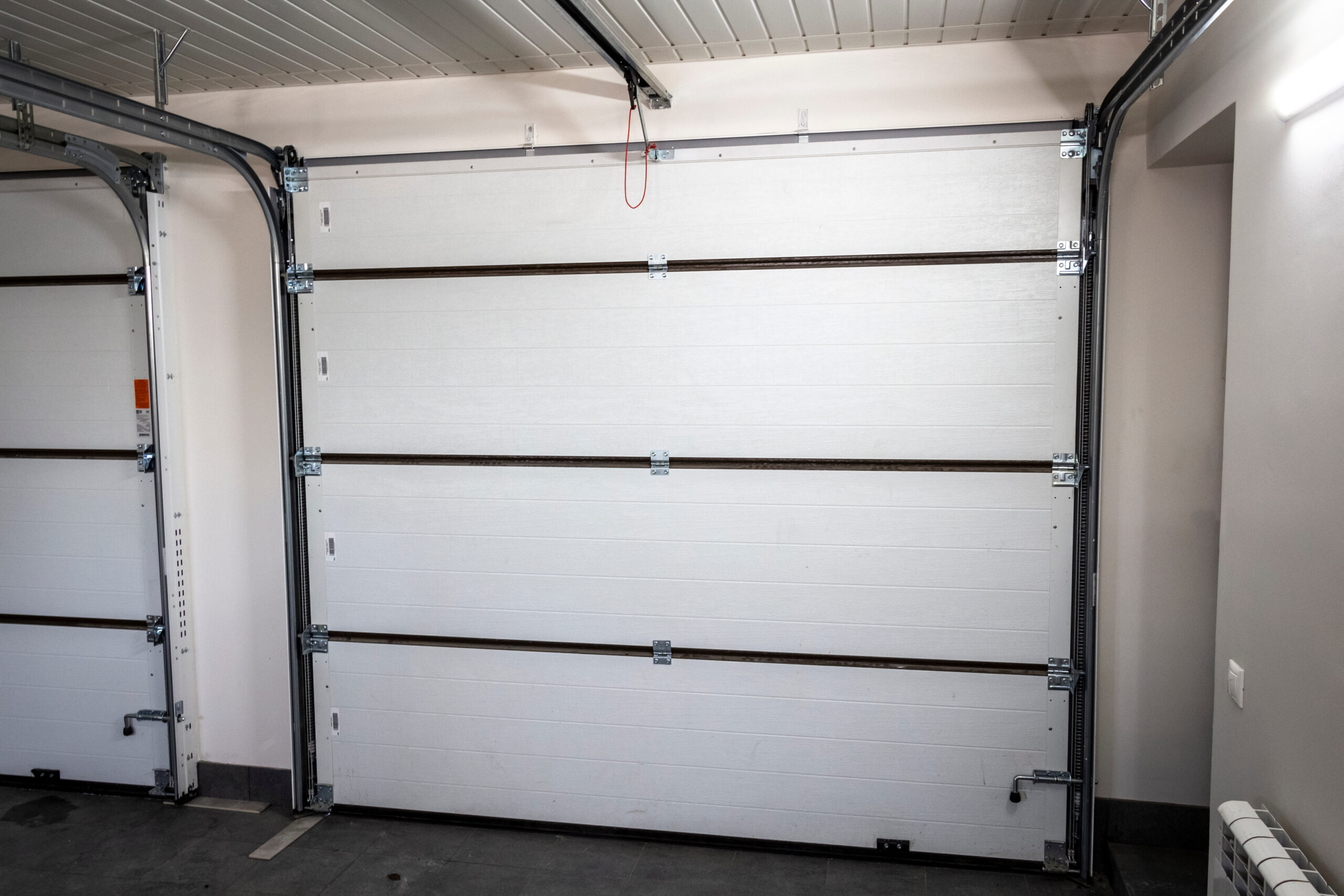 view from inside a garage looking toward the garage door to show how to know your garage door type number