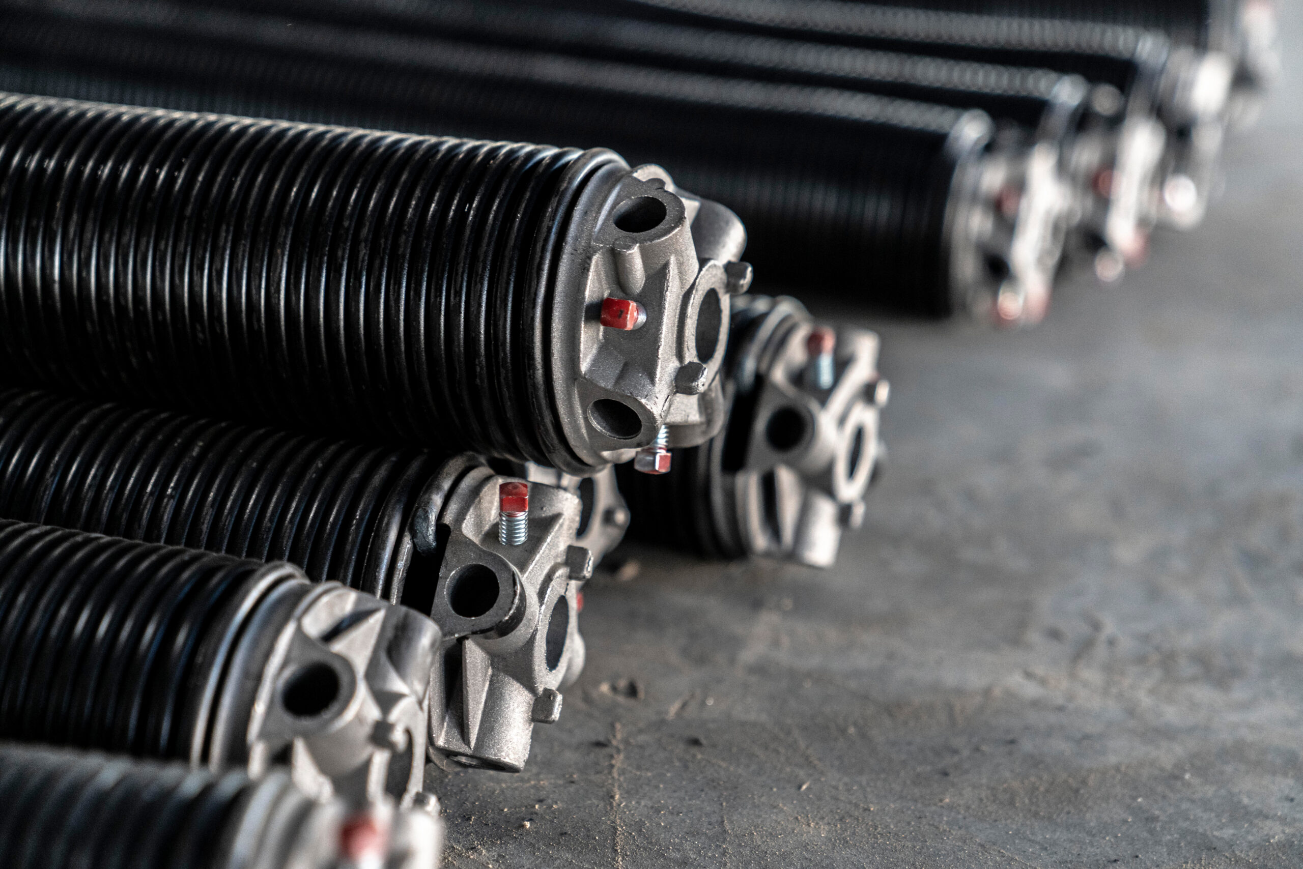 pile of spring needed to replace garage door spring